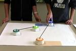 Learning Symmetry with Tangible Robots