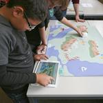 Windfield: learning wind meteorology with handheld haptic robots